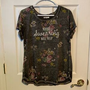 Super cute women’s top in large. Maybe swearing will help on front.
